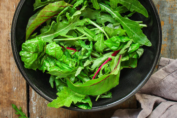 healthy salad with boiled egg, mix lettuce leaves, tomatoo, appetizer, snack. food background. top view. copy space