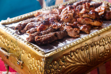 Tasty beef meat cooking on grill in arabic restaurant