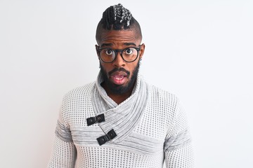 African american man wearing grey sweater and glasses over isolated white background afraid and shocked with surprise expression, fear and excited face.