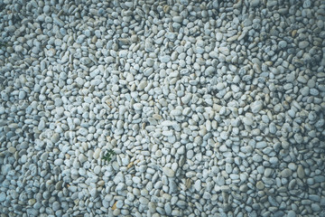 White pebble stone texture on the ground abstract background graphic
