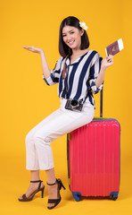 Tourist woman in summer casual clothes.Asian Smiling woman .Passenger traveling abroad to travel on colour background.Asian woman going to summer vacation.Travel trip funny.
