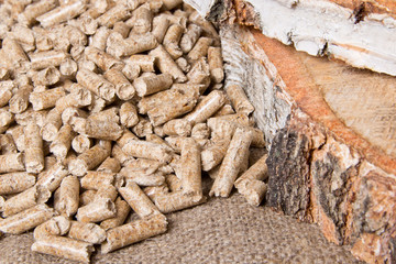 Wood pellets close up .Wooden pellet bio fuel. Biomass Pellets - cheap energy. The cat litter.