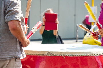 Cropped image of drummer players, outdoors. Selective focus