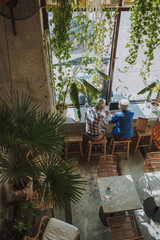 Cafe interior and two people by the window stock photo