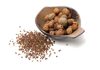 Violet cardamom Seeds CaoDouKou or Alpinia katsumadai Hayata on white background