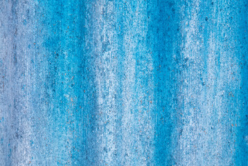 The wall is painted with blue paint as an abstract background