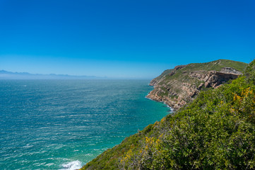 Fototapeta na wymiar Summer landscape with cliff shore and beautiful ocean