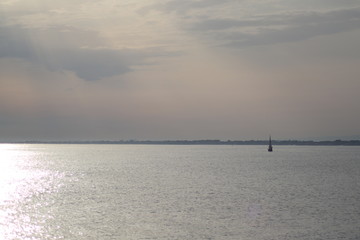 fishing boat in sea at sunset