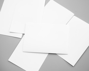 envelope with blank paper, Poster mock-ups paper, white paper isolated on gray background, Blank portrait A4. brochure magazine isolated on gray, can use banners products business texture background 