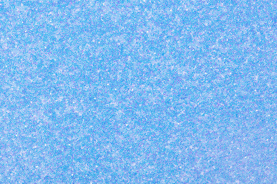 Holographic glitter background in new light blue tone as part of your attractive design. High quality texture in extremely high resolution, 50 megapixels photo.