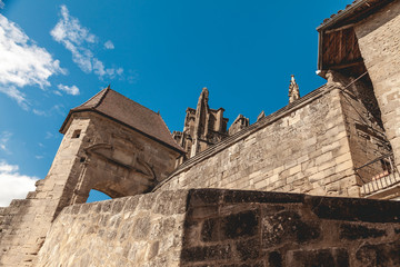 view from below of the majestic walls of the abbey of saint Antoine