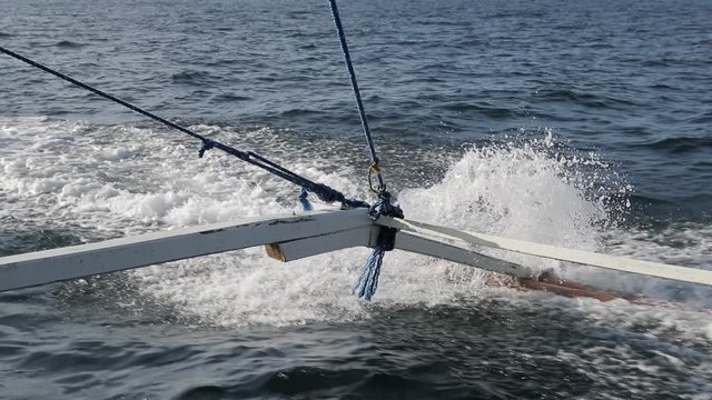 Water splash and sprays coming from Philippines boat with tourists, filmed in slow motion