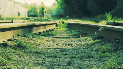 Girl Goes on Abandoned Rails 