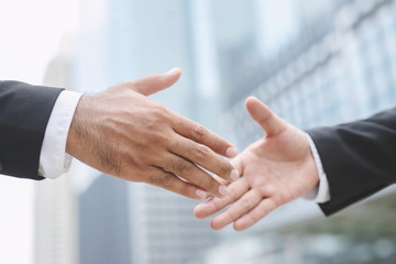 Closeup of a businessman hand shake investor between two colleagues  OK, succeed in business...