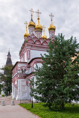 Fototapeta na wymiar Entrance gate to the monastery, side view. Russian shrines. Joseph-Volotsky Monastery in Teryaev. Moscow region, Teryaevo.