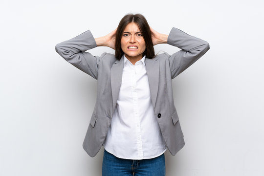 Young Business Woman Over Isolated White Background Frustrated And Takes Hands On Head