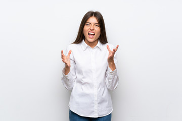 Young woman over isolated white background unhappy and frustrated with something