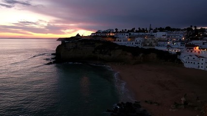 Aerial from the village Carvoeiro in Portugal at sunset