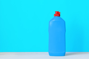bottle of cleaning agent on a colored background