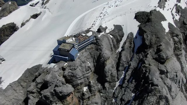 Drone view to cable car station on the top of Titlis mountain in Switzerland.