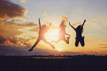 Concept of female friendship.Happiness friends at sunset time.