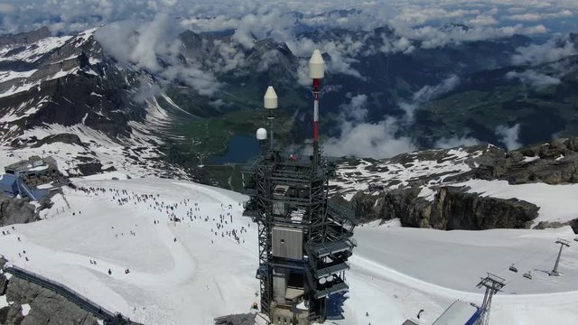 Drone view to antenna on the top of Titlis mountain in Switzerland. Shot was made in June.