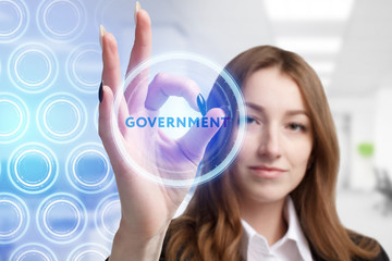 The concept of business, technology, the Internet and the network. A young entrepreneur working on a virtual screen of the future and sees the inscription: Government