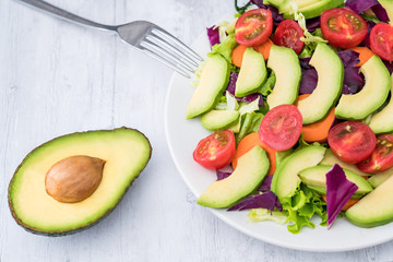 Healthy weight loss food: A plate of avocado and vegetable salad 