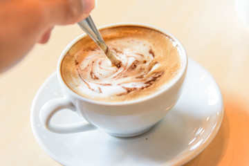 stir the coffee in cup and take to drink