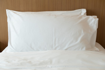 Comfortable soft pillows on the bed