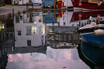 Fototapeta na wymiar Reflections in the harbour, Mevagissey, Cornwall