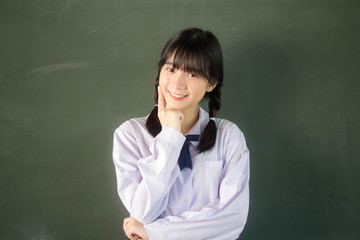 Portrait of thai high school student uniform teen beautiful girl happy and relax