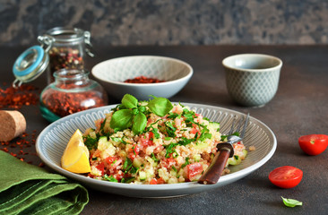 Tabule - a traditional oriental salad with vegetables, parsley and spices.