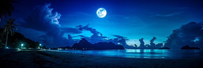 Colorful blue sky with cloud and bright full moon on seascape to night