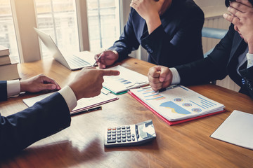 Businessmen who fail at work The boss pointing the finger at the employee who made the mistake in...