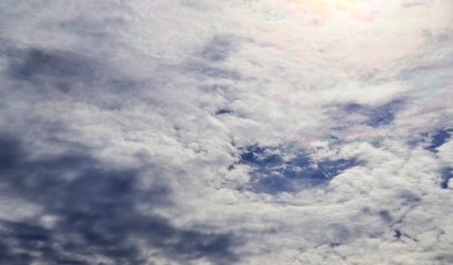 Stunning mixed cloud formation panorama  on a deep blue summer sky