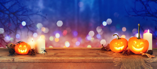 Halloween holiday concept with jack o lantern pumpkin over dark night background