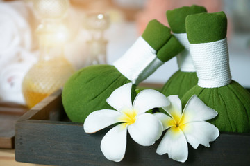 Set of herbal compress massage in the spa massage salon.
