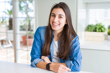 Beautiful young brunette woman smiling cheerful looking at the camera with a big smile on face showing teeth