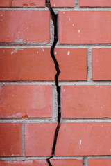 crack in the brick wall, signs of deformation of the building