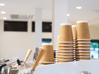 heap of disposable recycling paper cup on coffee machine