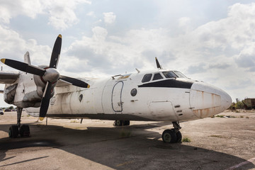 Fototapeta na wymiar Old rusty plane at an abandoned airport