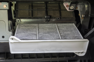 Replacing an old dirty car filter with a new clean one