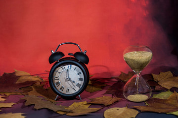 Red lantern lamp with candle and apples on red background.