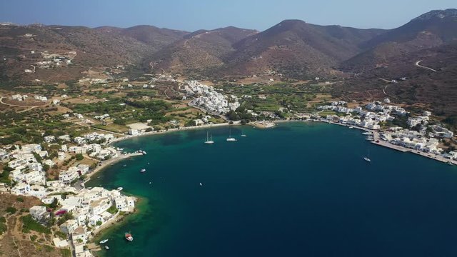 Aerial drone video of iconic port and picturesque village of Katapola in island of Amorgos, Cyclades, Greece