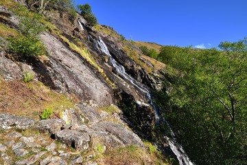 Fototapeta premium Cascade of water on the slopes of Base Brown