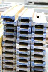 Blue wooden beams for scaffolding