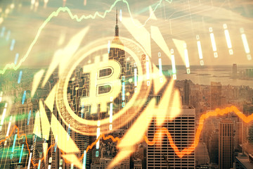 Double exposure of crypto currency theme hologram drawing and city veiw background. Concept of blockchain and bitcoin.