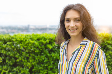 Portrait charming beautiful business woman or working woman. Attractive beautiful businesswoman stand on the top of building at company or office. She get successful of business when she was young