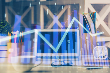 Double exposure of forex chart and work space with computer. Concept of international online trading.